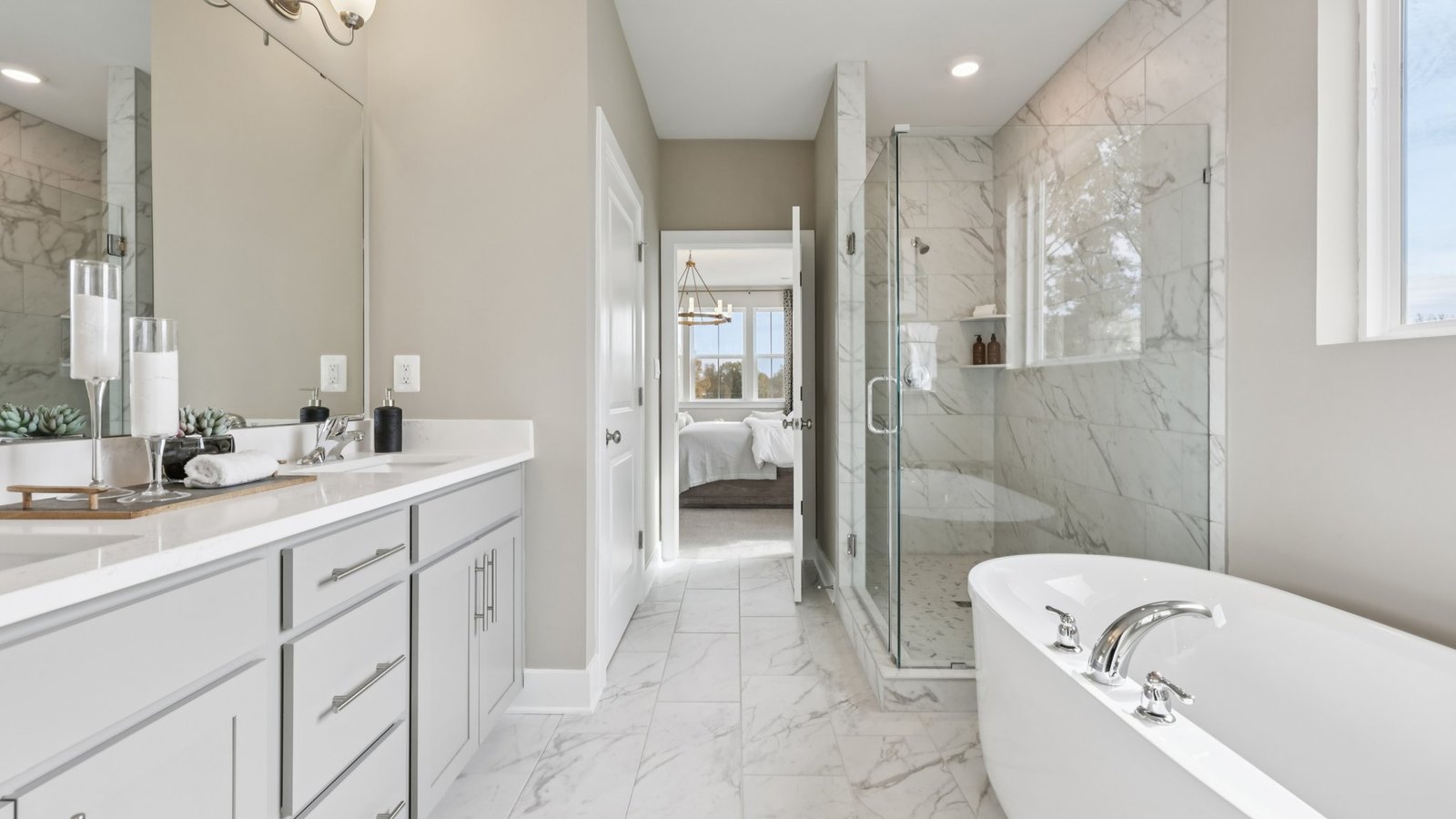 primary full bathroom with dual snk vanity and walk in shower