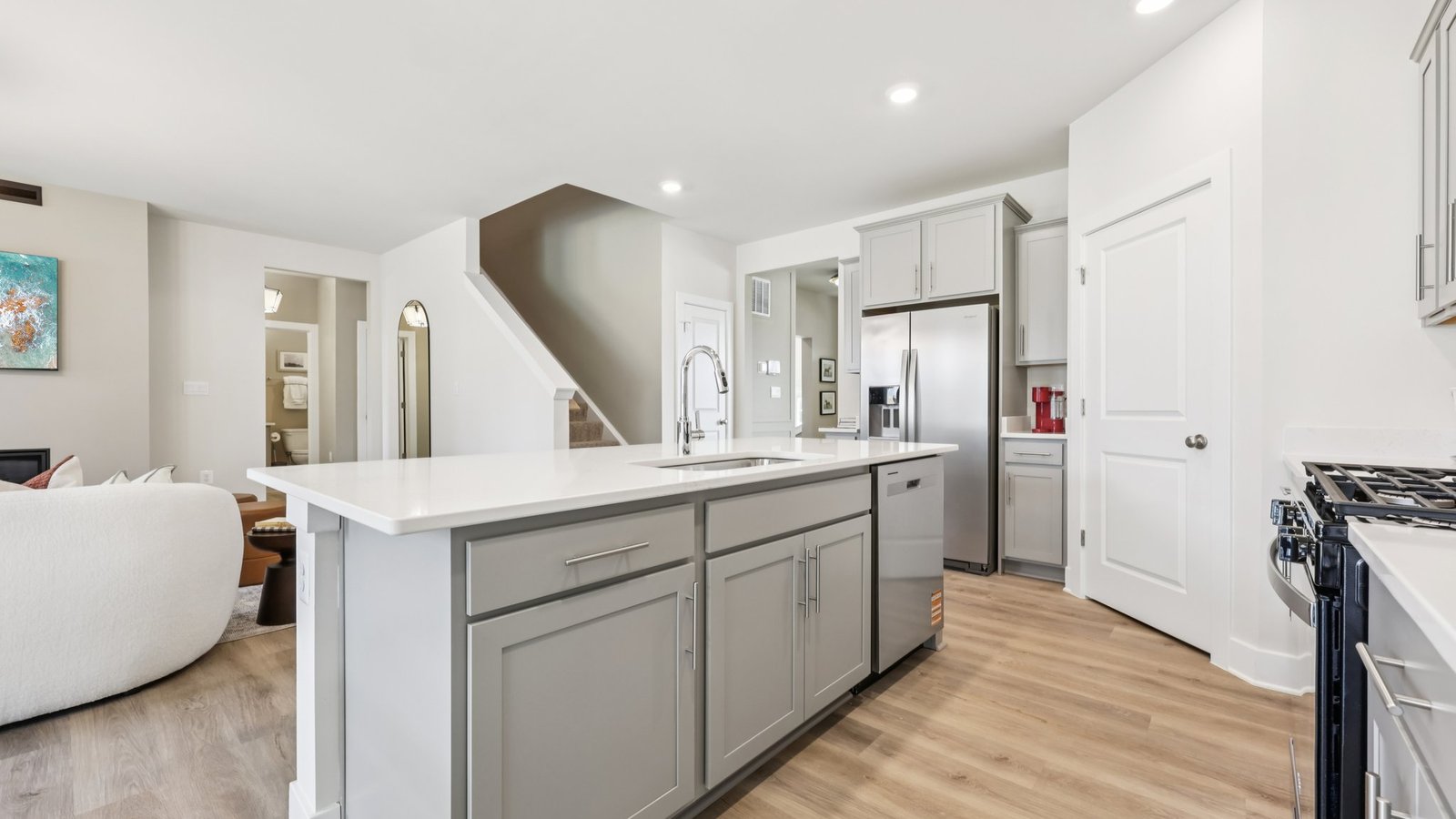 The kitchen features upgraded cabinets and stainless steel appliances