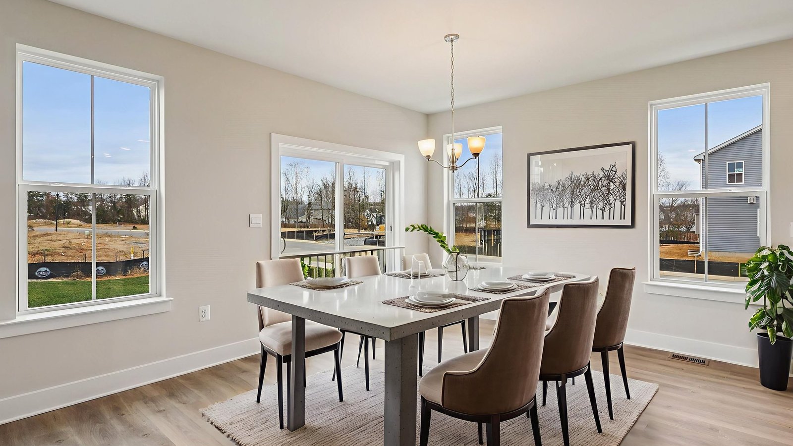 Virtually staged dining area next to the kitchen