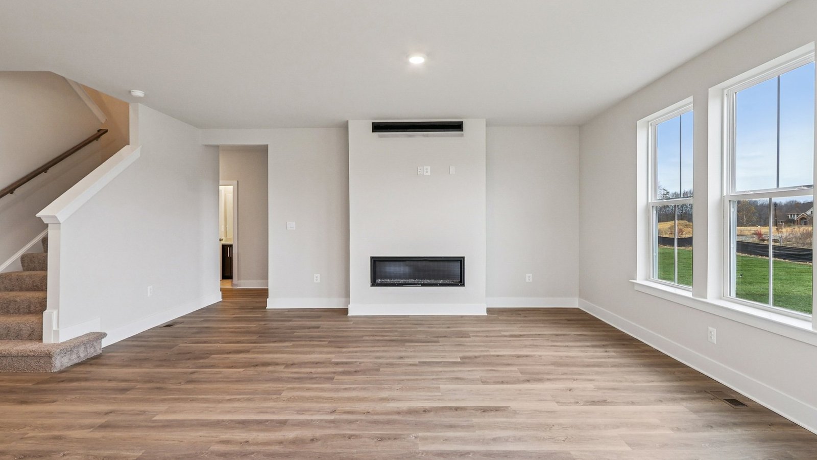 Lots of natural light, windows and fireplace in a living room