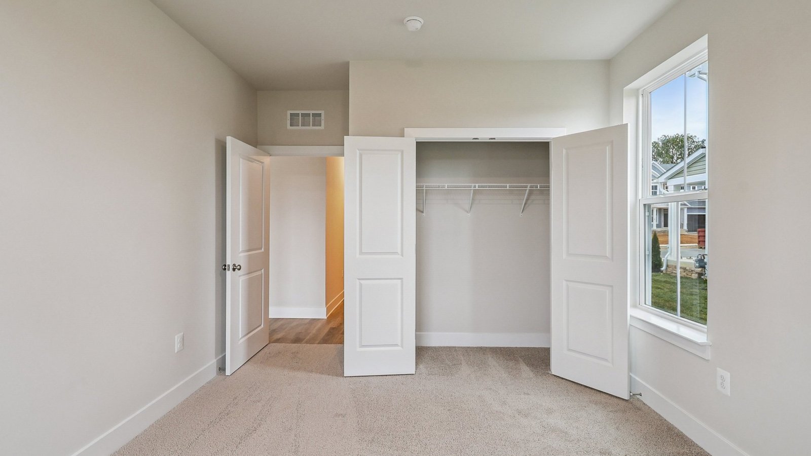 First floor guest bedroom closet copen doors
