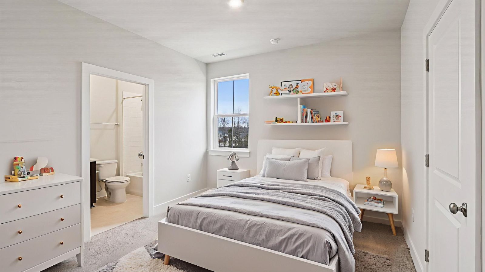 Comfortable secondary bedroom in a new construction home in Fredericksburg, VA with bright natural light and versatile living space.
