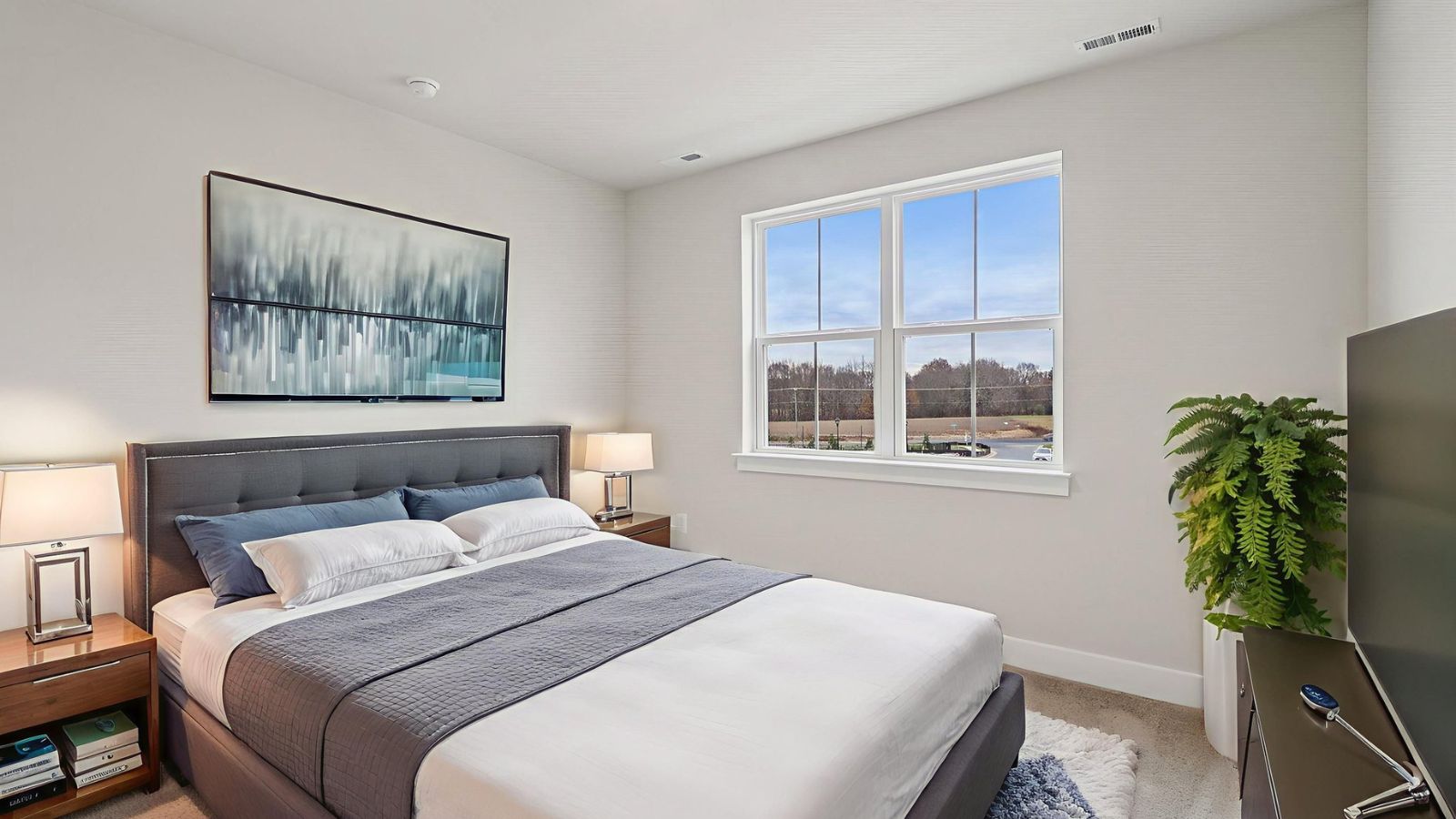 Comfortable secondary bedroom in a new construction home in Fredericksburg, VA with bright natural light and versatile living space.