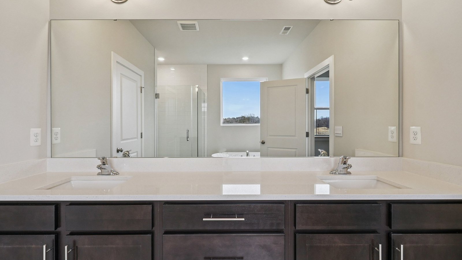 primary bathroom with dual sink vanity