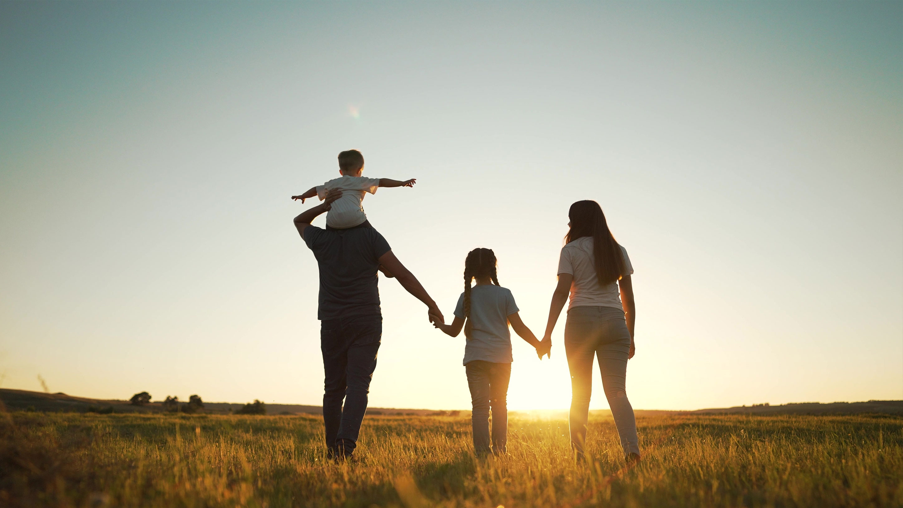 Family walking in the fields