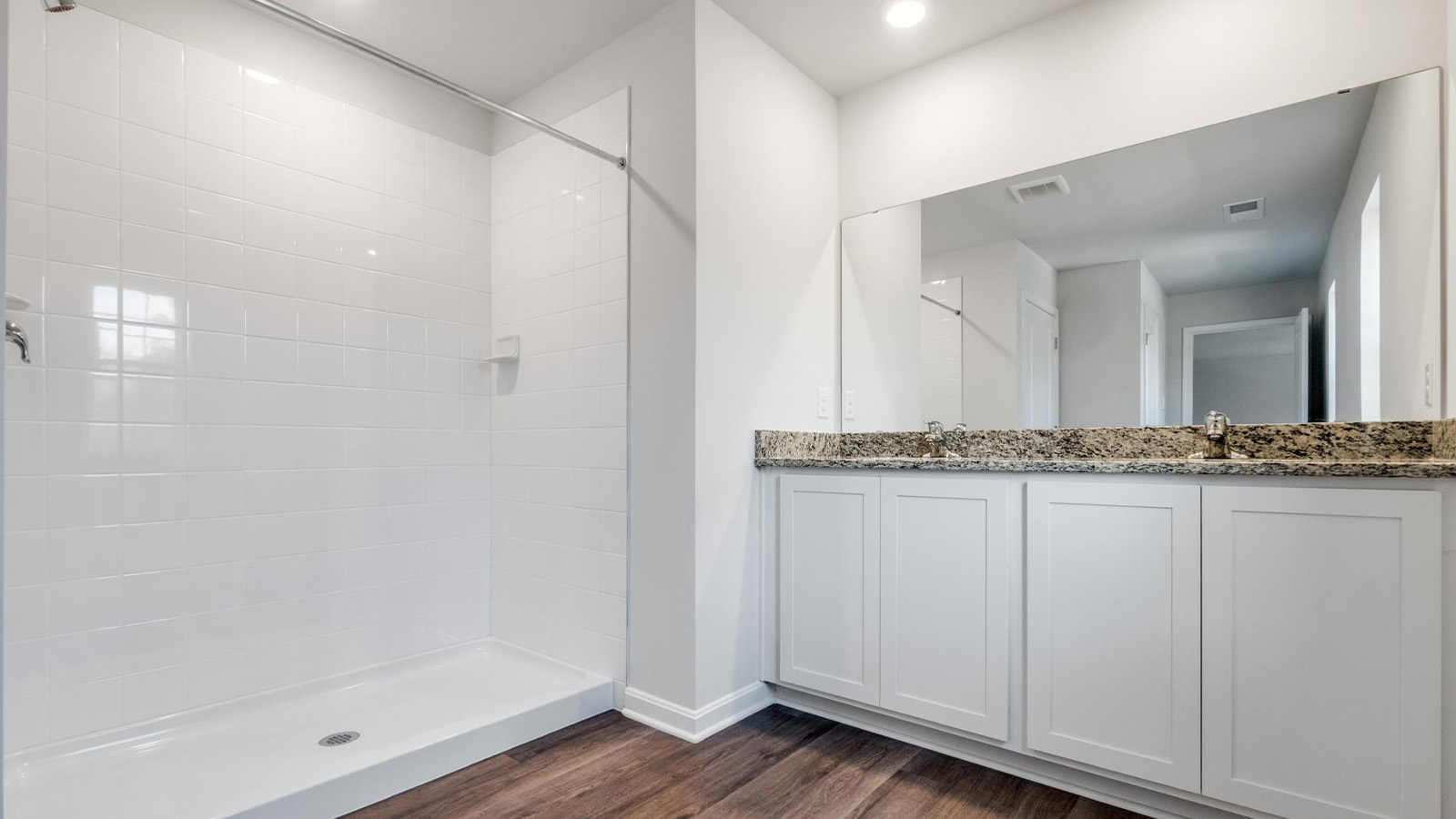 primary full bathroom with dual sink vanity