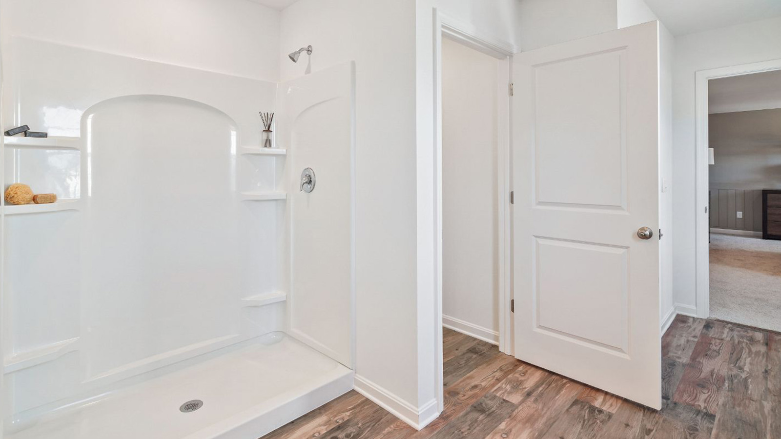 full primary bathroom with double sink vanity and walk in shower
