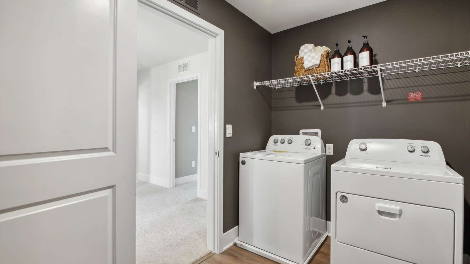 laundry room with storage shelves