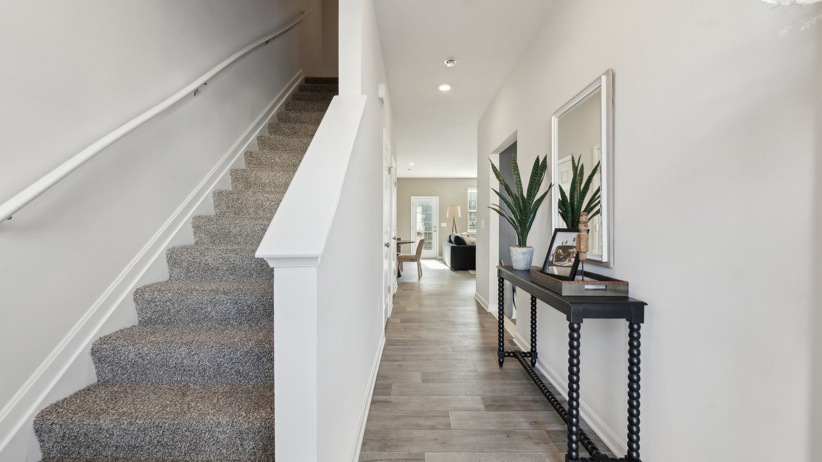 As you walk into the front door, the stairs to the second level are on your left