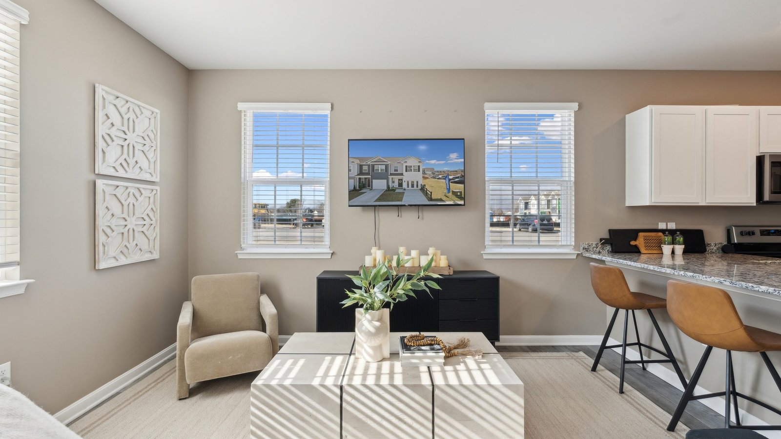 The kitchen counter overlooks living and dining areas