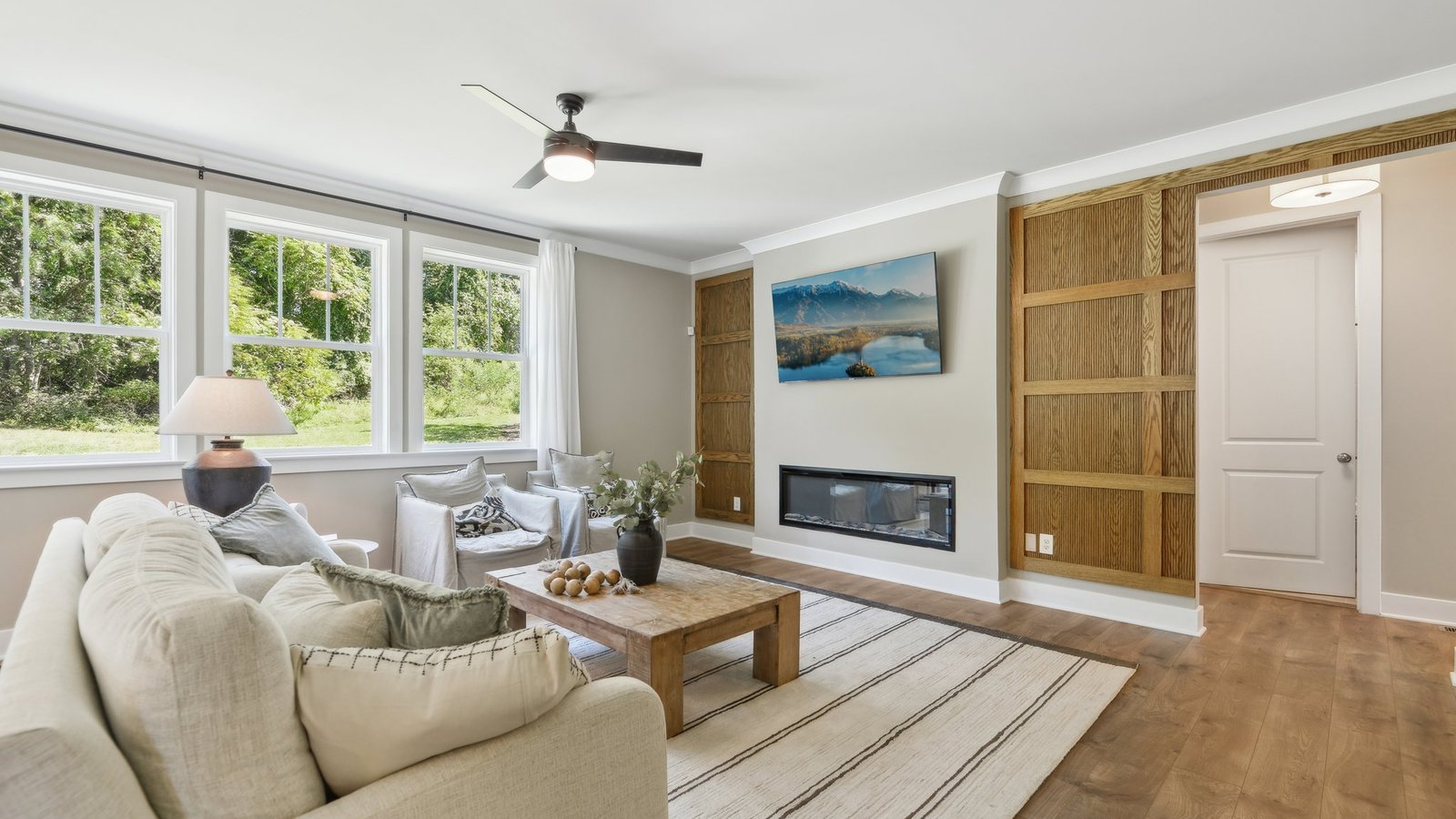 Living area is defined by a large area rug