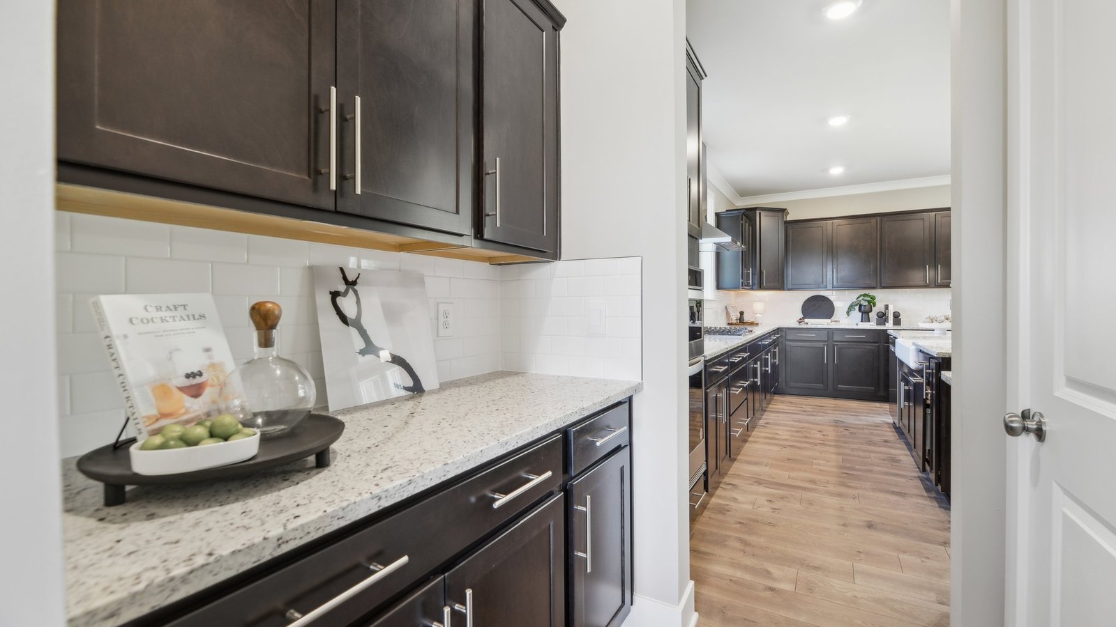 Extra counter space between kitchen and formal dining allows for effortless hosting