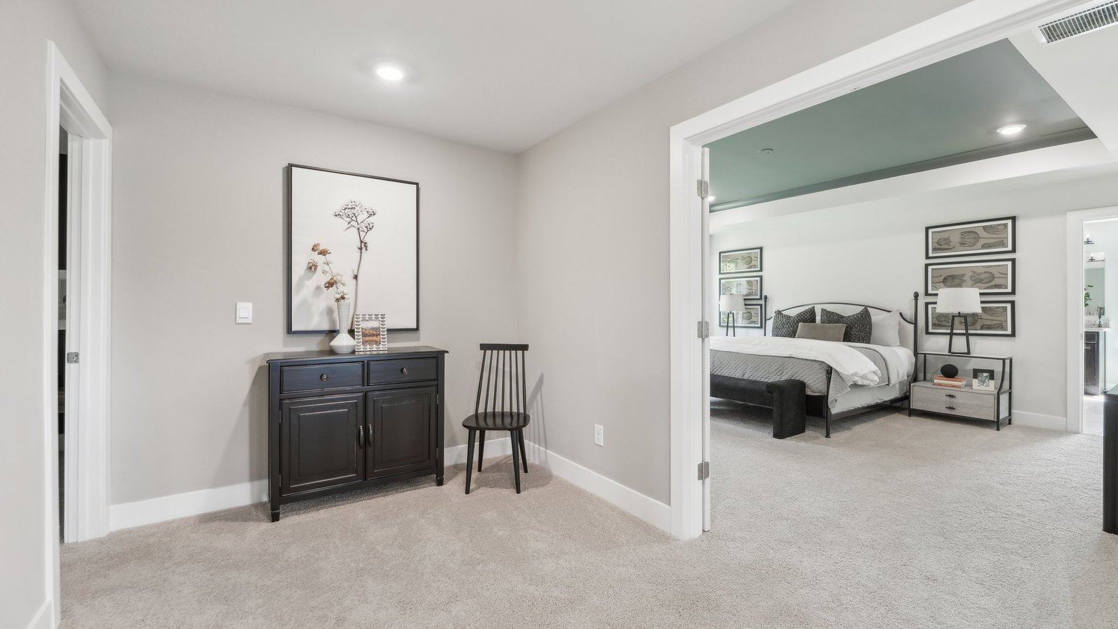 Double doors open into the primary bedroom
