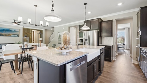 beautiful kitchen overlooks casual dining and living area
