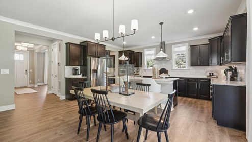 Walk into the front door, pass the casual dining and flex room and enter the beautiful kitchen