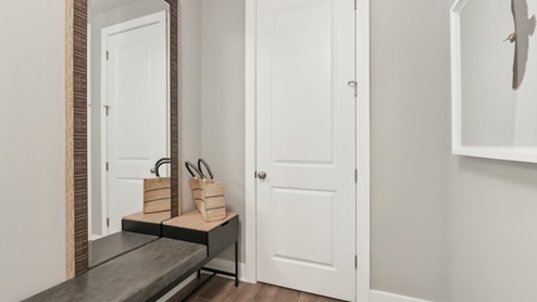 hallway decorated with a shoe rack and bench