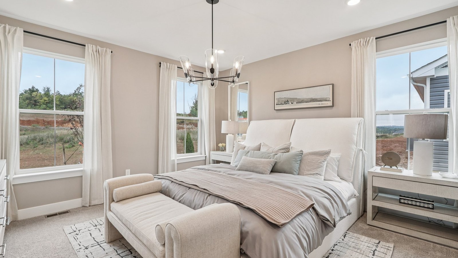 primary bedroom with king bed and modern design