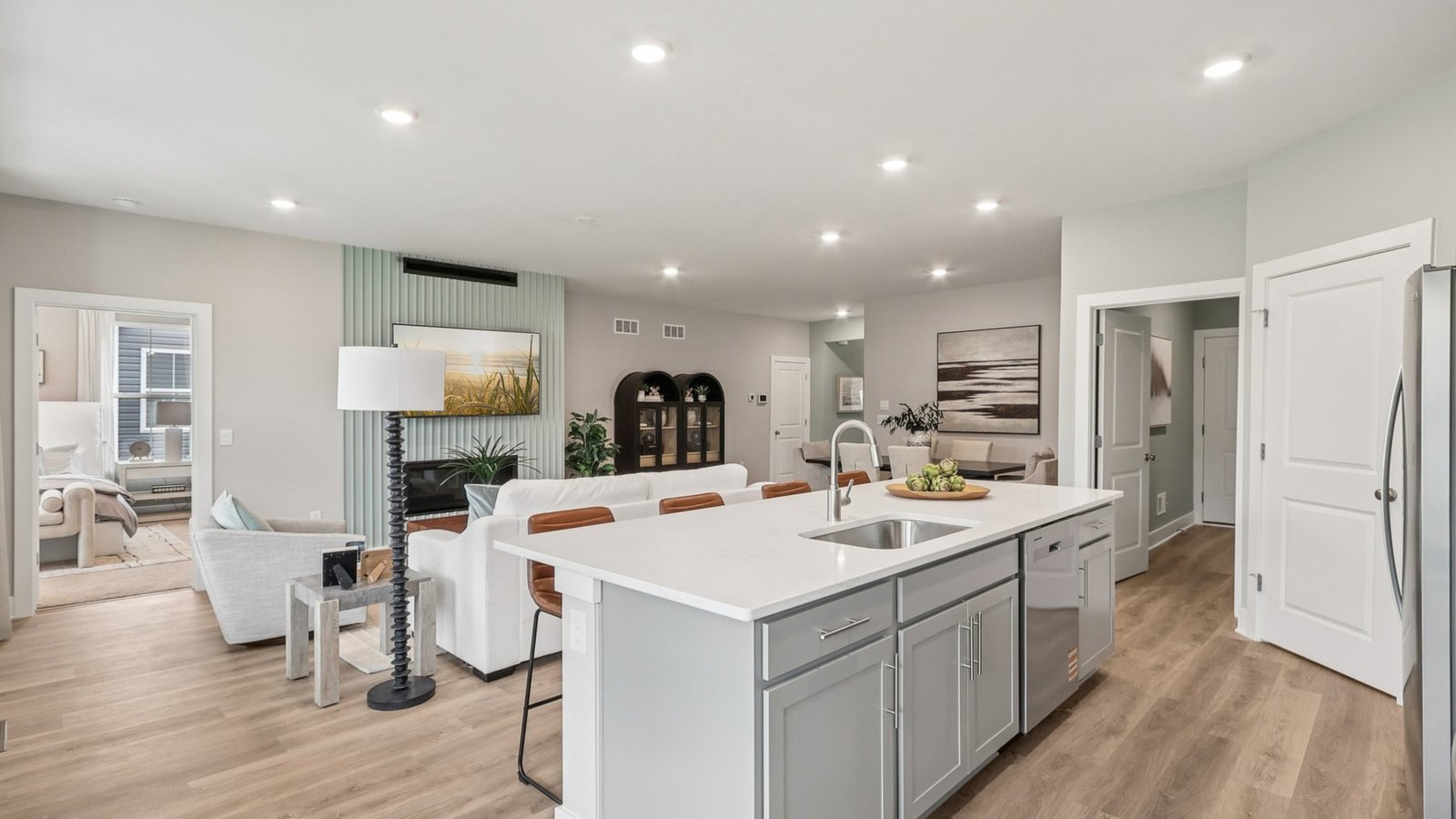 Kitchen island overlooks dining, living, and breakfast area