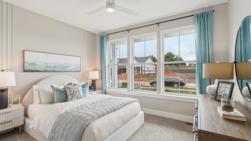 Secondary bedroom on the main floor overlooking the front yard