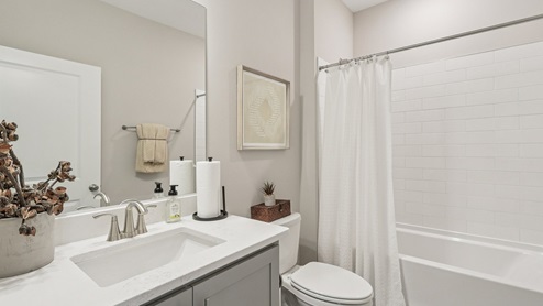Secondary bathroom located between two secondary bedrooms comes with a bathtub