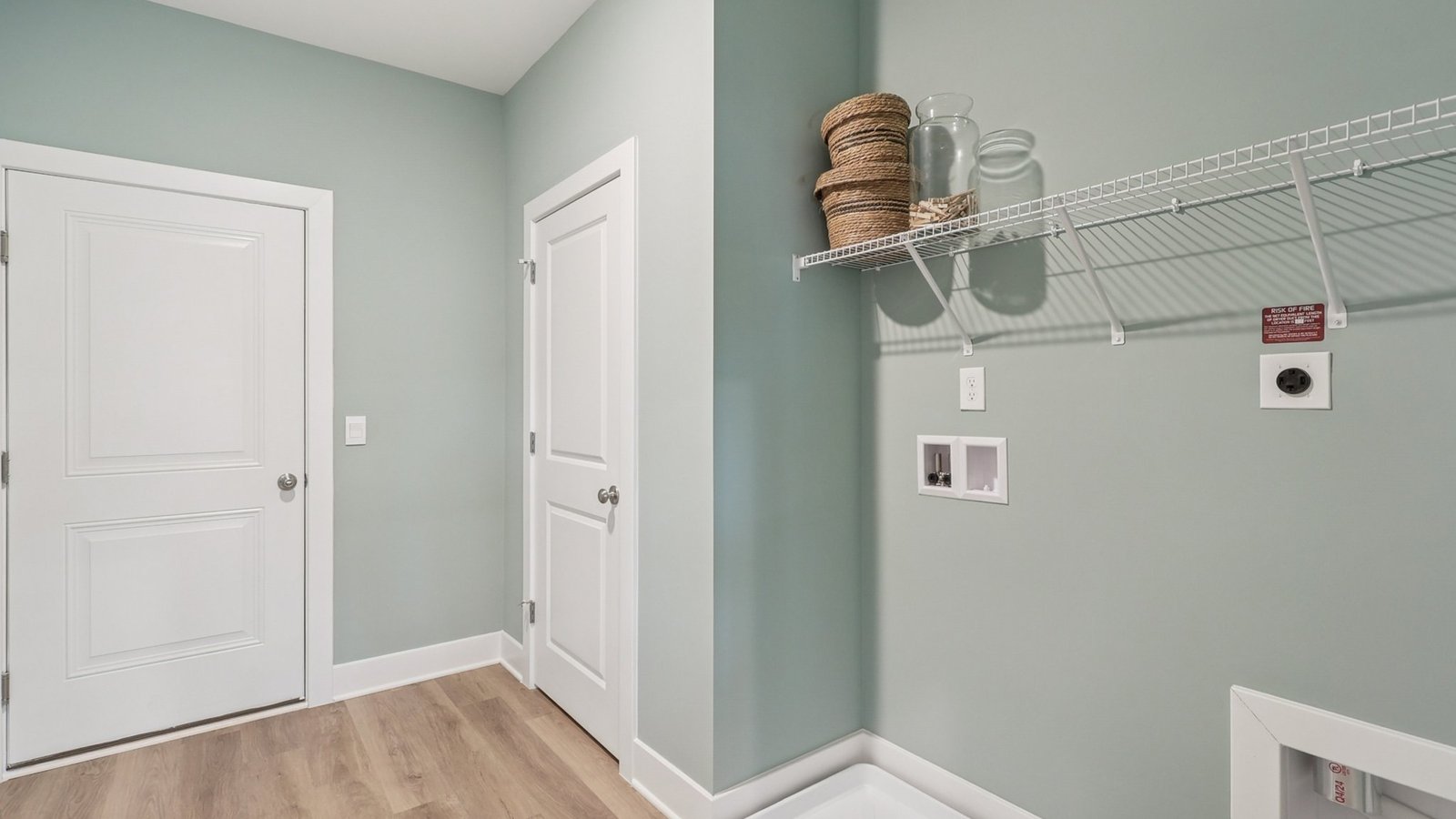 conveniently placed laundry room connects garage to the kitchen and pantry