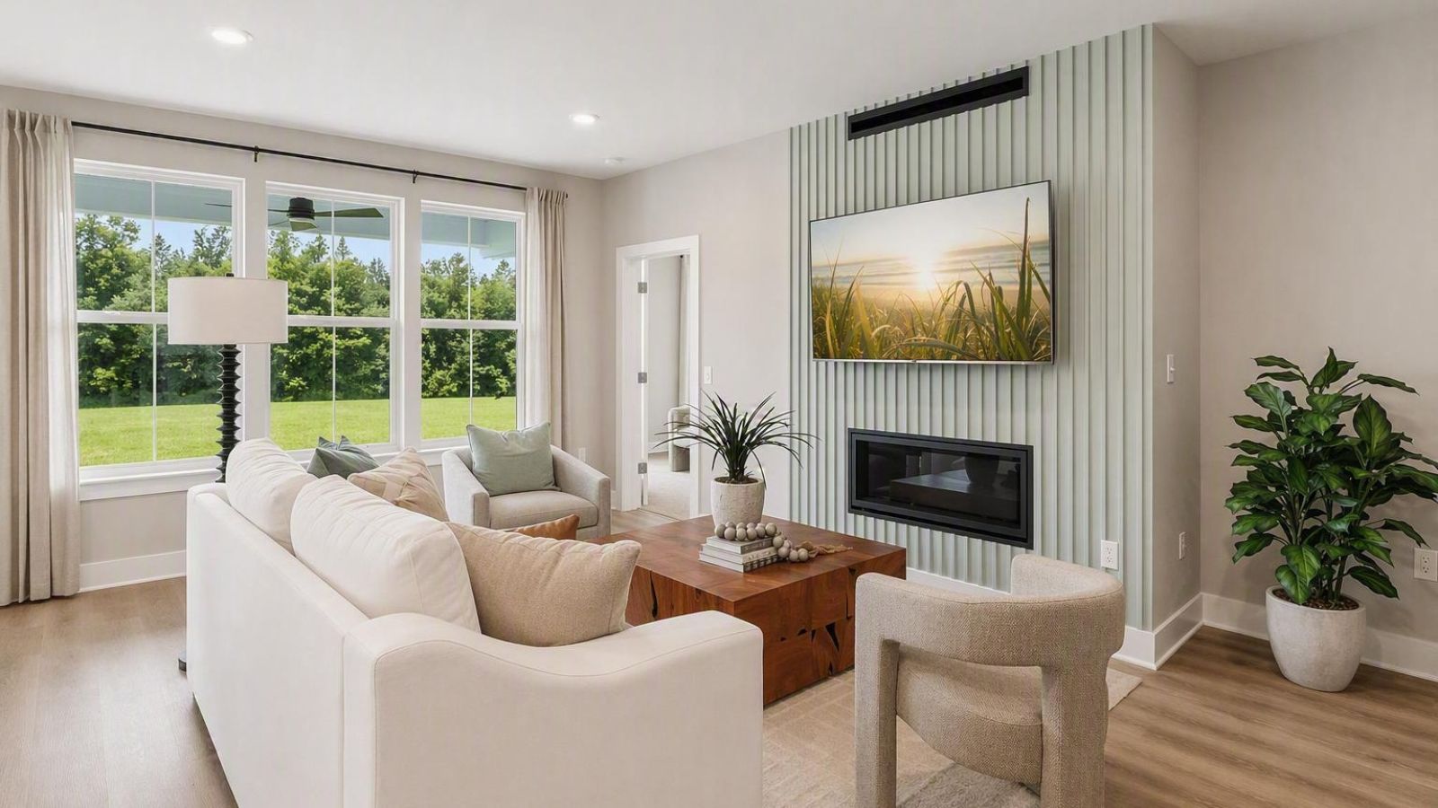 Living room has large windows which let in a lot of natural light