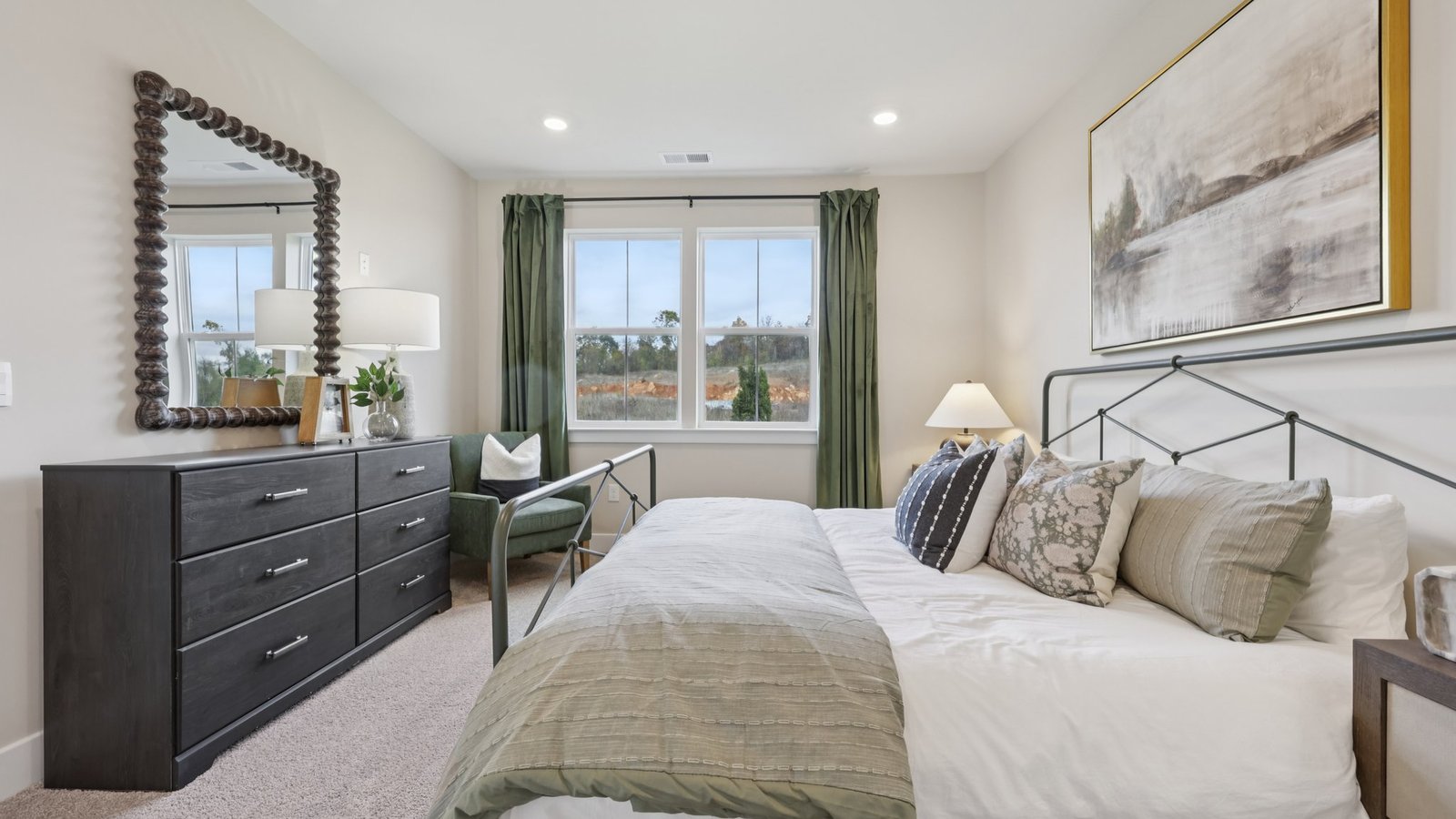 spacious primary bedroom with modern design