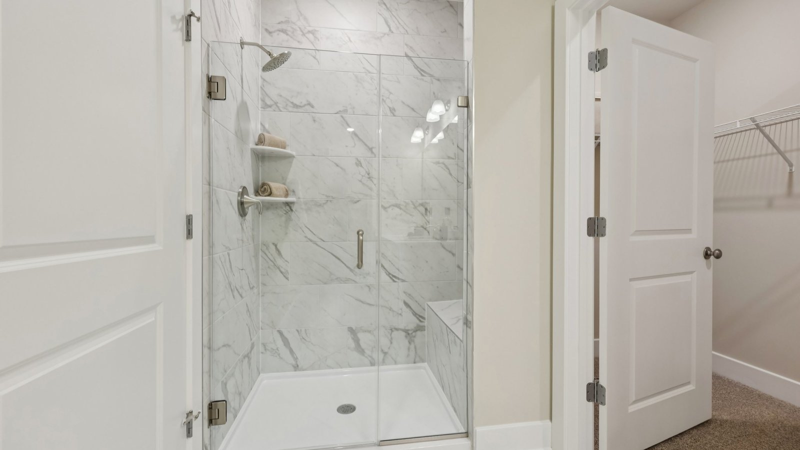 full primary bathroom with double sink vanity and walk in shower