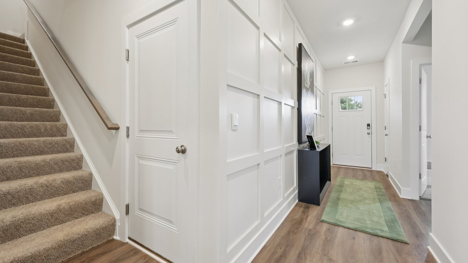 Through the foyer and to the right are the stairs to the loft