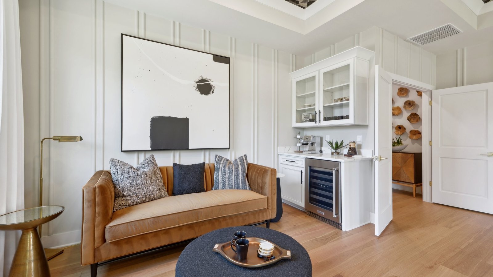 our model is decorated with large art pieces that amplify the grandeur of the space