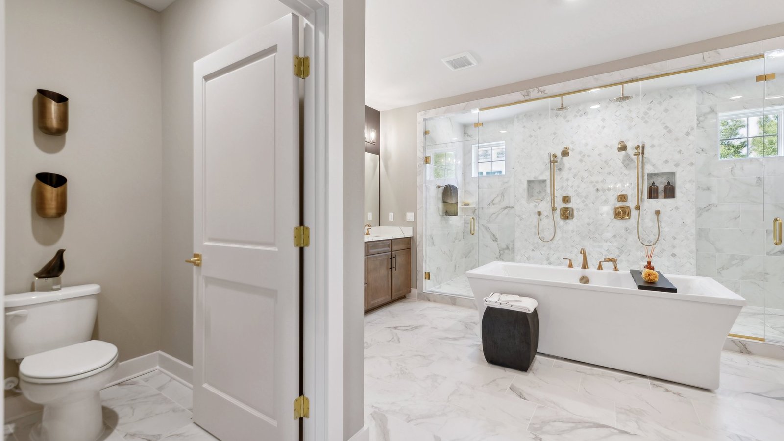 toilet is separated by the door from the primary bathroom
