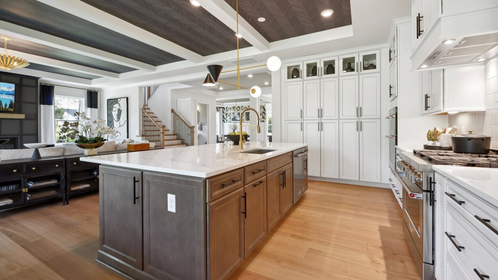 large luxurious kitchen island includes a sink and plenty of space to cook or eat