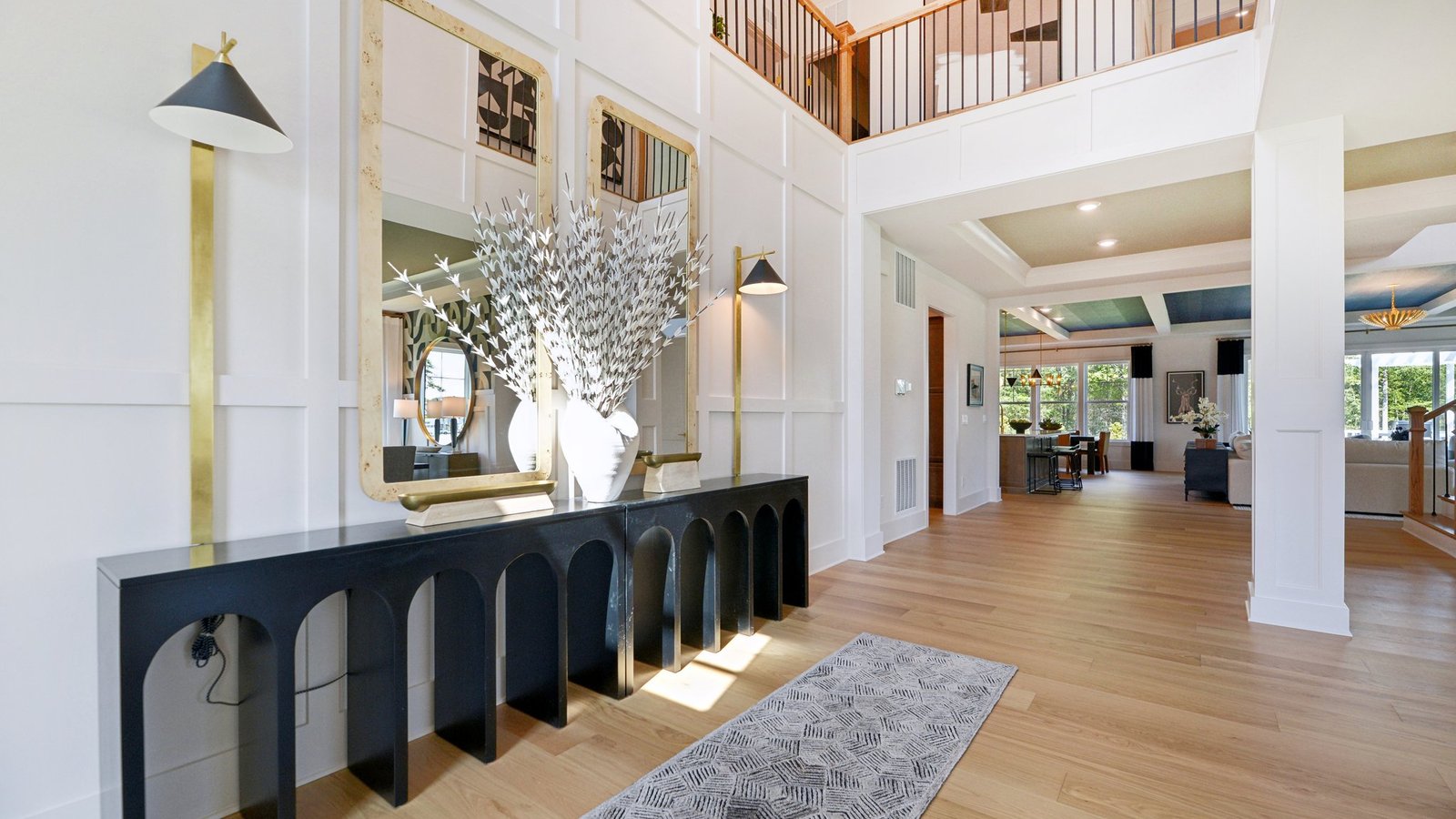 The foyer is decorated with 2 large mirrors that make the space feel even more spacious