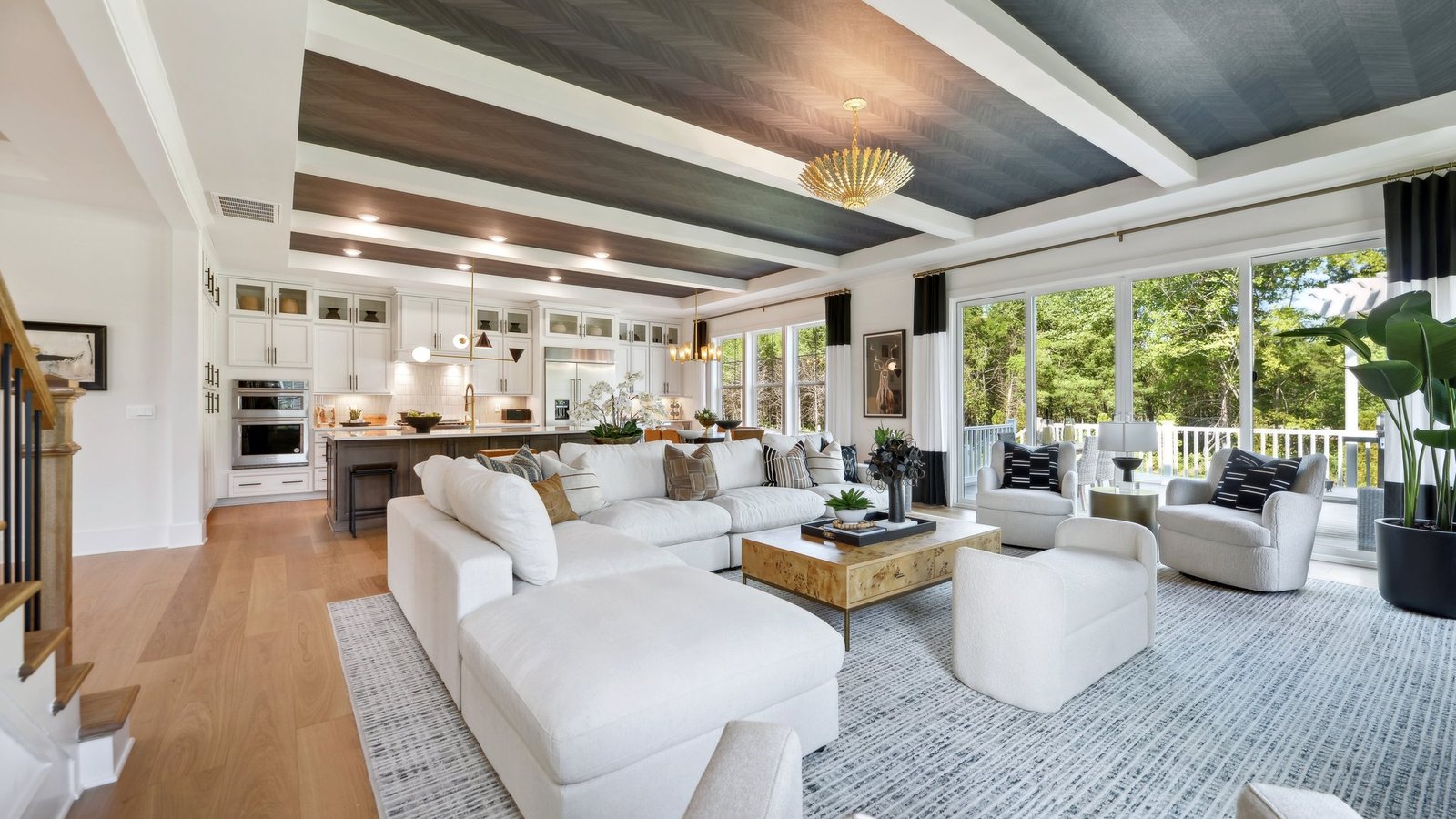 open concept main floor area combines kitchen, dining, and great rooms