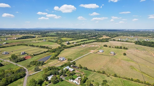 Aerial photos of the community shows large plots of lands