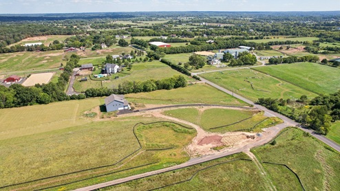 Aerial photos of the community shows large plots of lands