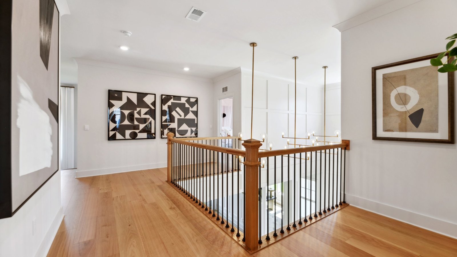 upstairs hallway decorated with art