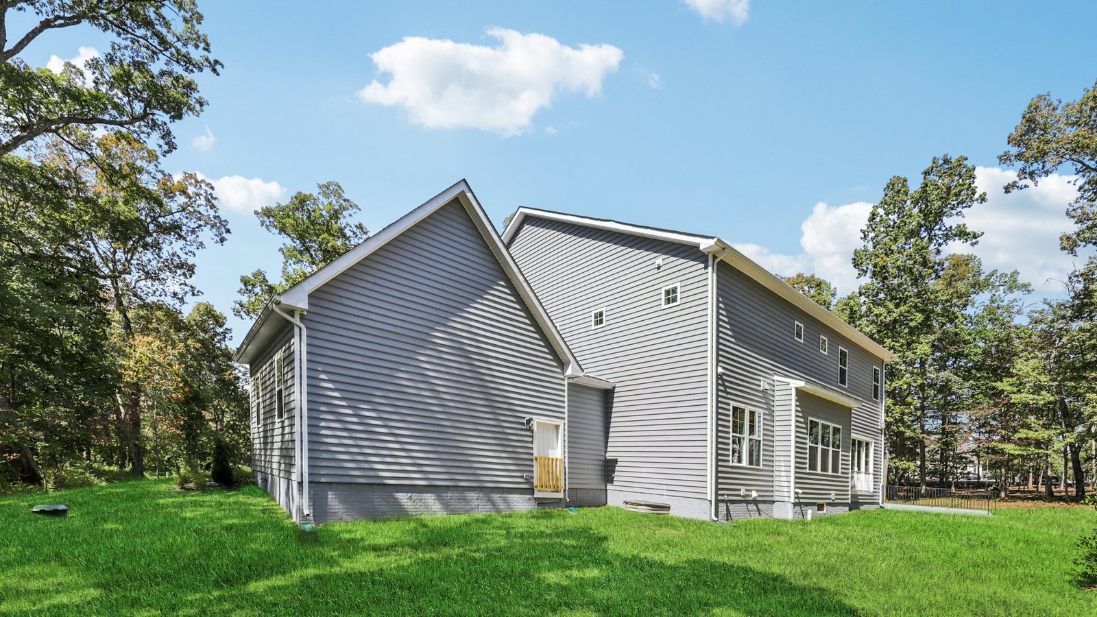 Back of the home features a patio