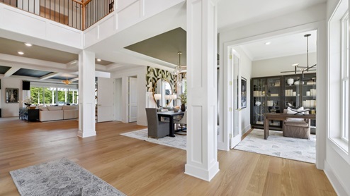 As you walk into the grand foyer, the office space is to your right