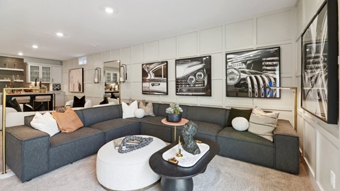 basement rec room features a corner couch