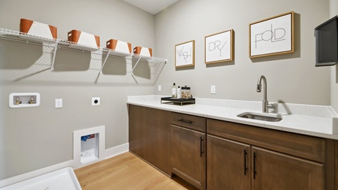 laundry room is equipped with a sink