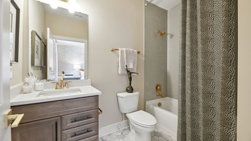 bathroom with bathtub and shower