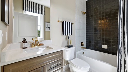 bathroom with bathtub and shower head
