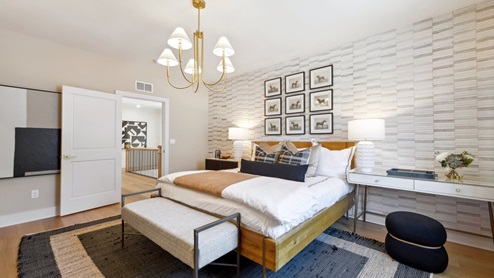 spacious bedroom with a space for a desk