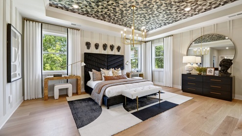 Our model primary bedroom is decorated with beautiful ceiling wallpaper