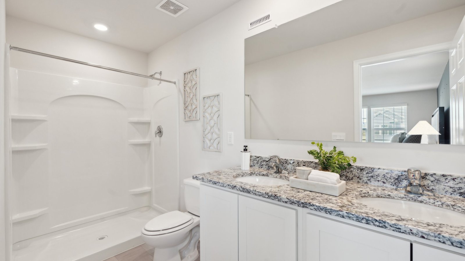 primary bathroom with dual sink vanity