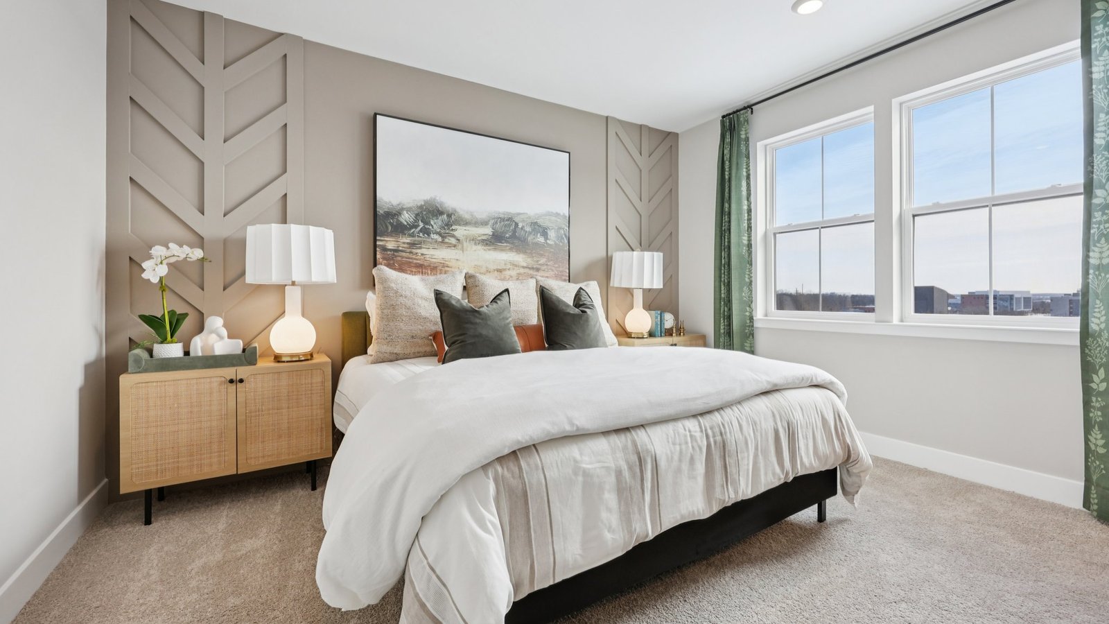 modern open primary bedroom with bright lighting