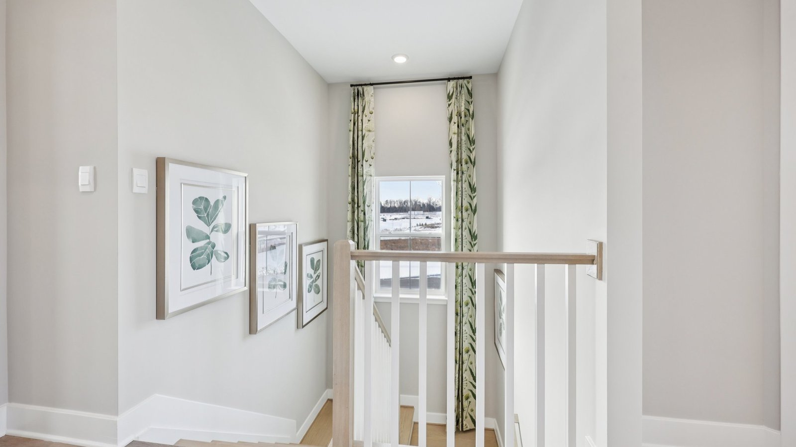 staircase and hallway with natural lighting