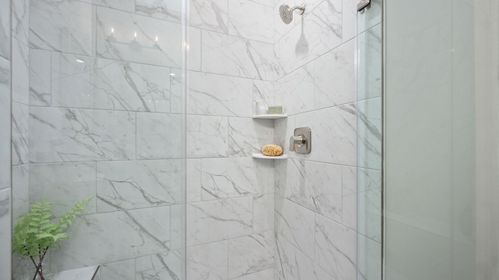 full primary bathroom with walk in shower and dual sink vanity