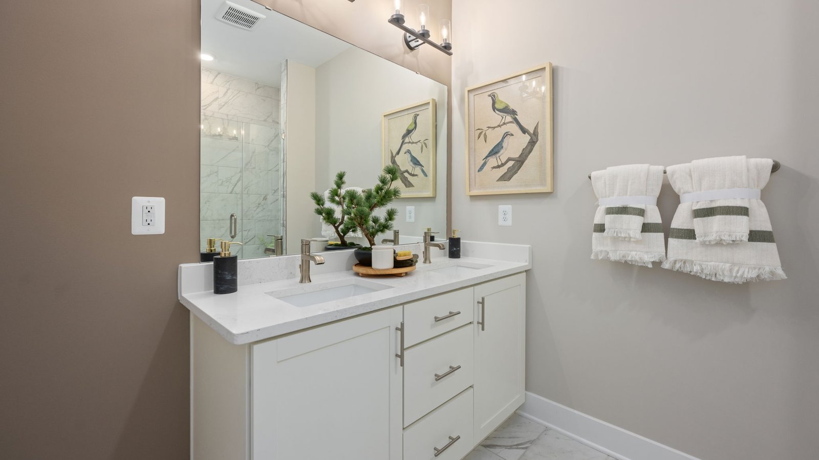 Primary bathroom with dual vanity in modern townhome